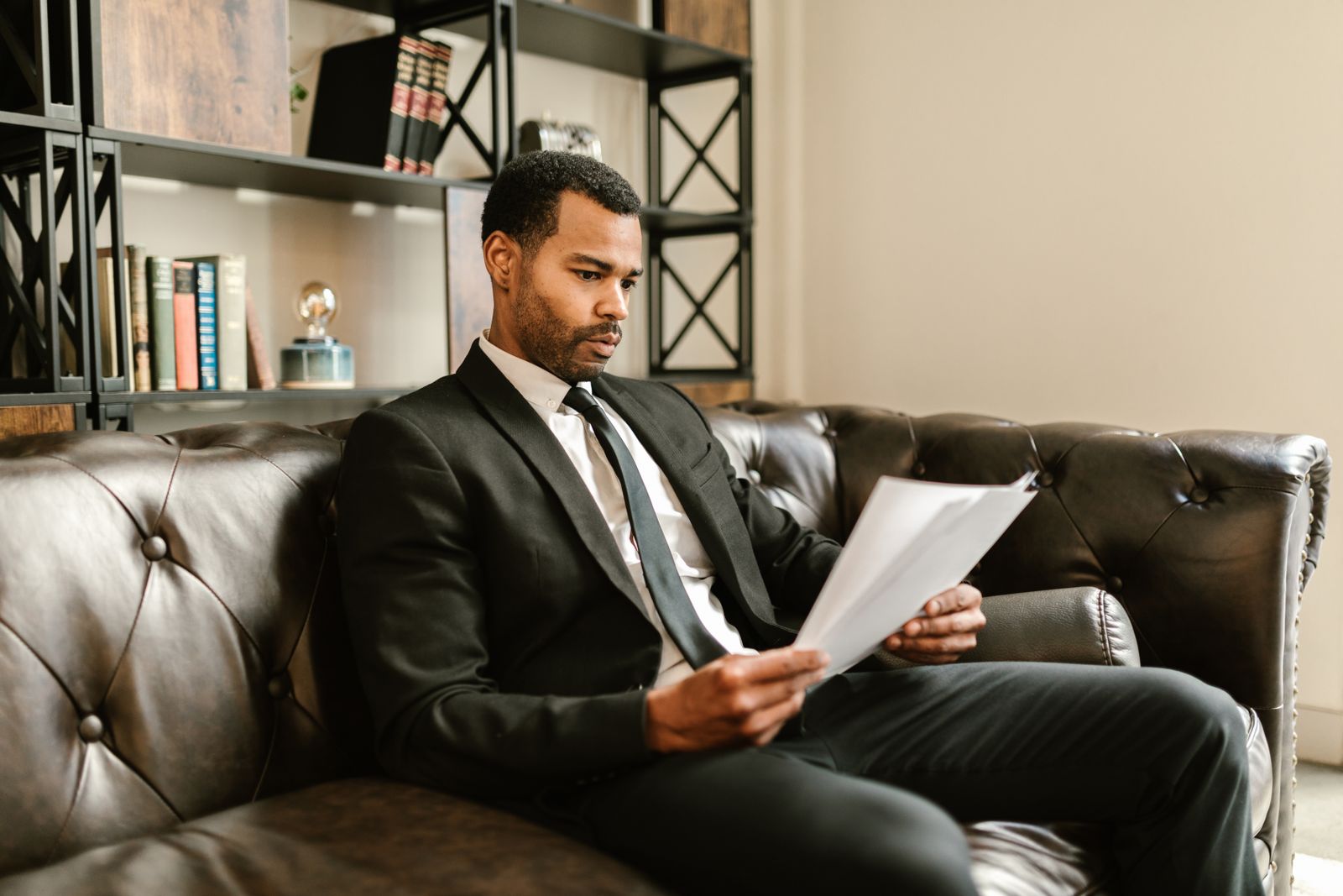 A business professional reviewing documents in an office